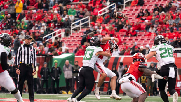 Oct 28, 2023; Salt Lake City, Utah, USA; Utah quarterback Bryson Barnes (16) is sacked by Oregon Ducks defensive back Evan Williams (33) in the second half at Rice-Eccles Stadium. Mandatory Credit: Gabriel Mayberry-USA TODAY Sports